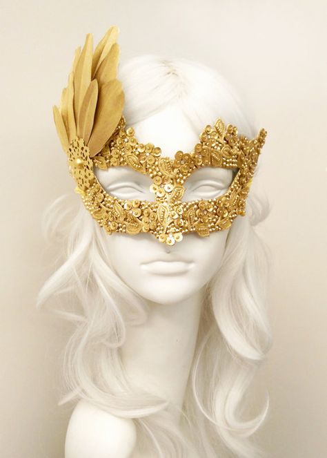 Gold color Venetian mask with rhinestone and bead embellishments, fabric applique, sequin flowers and gold feather fan. PAYMENT: Following your order placement, you will receive an email from Shopier, which is integrated into Etsy with the Etsy API for payments. You can pay via “Pay Now” button in this email. Your order will be delivered with online tracking by DHL or UPS. Back surface is covered with fabric for comfortable use. Ribbons added both sides to tie. (Ribbons may be slightly differ... Gold And White Mask, Mascarade Mask Diy, Masquerade Mask Diy, Gold Masquerade Mask, Sequin Flowers, Masquerade Ball Mask, Makeup At Home, Prom Costume, Ball Mask