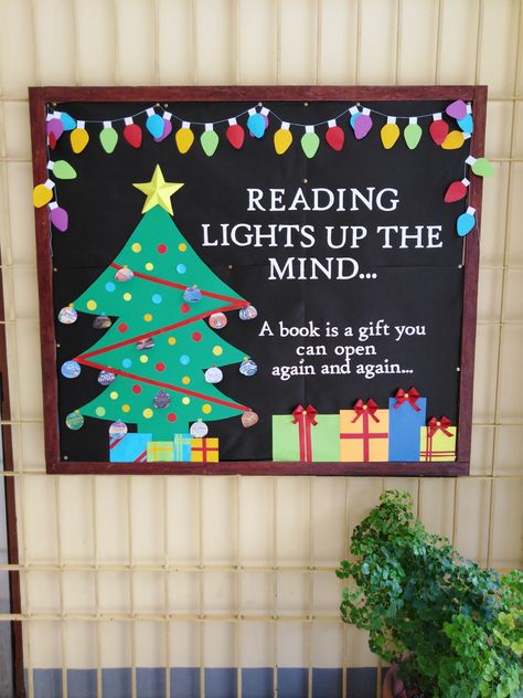 Reading Lights Up The Mind Bulletin Board, Christmas Book Fair Ideas, Library Bulletin Board Ideas Christmas, High School Bulletin Board Ideas Christmas, Christmas Book Themed Door Decorations, Christmas Bulletin Board Ideas For Library, Christmas Bulletin Board Idea, Reading Christmas Bulletin Boards, Christmas Reading Bulletin Board Ideas