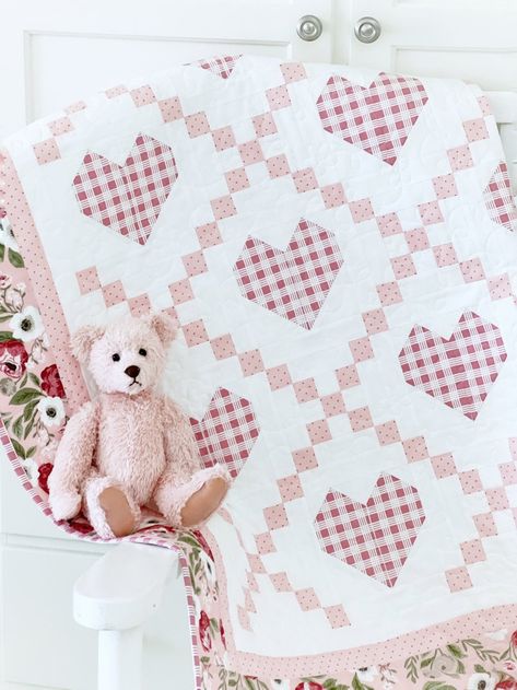 Hearts Delight Quilt Pattern PAPER Copy. This delightful quilt is all about cozy comfort and timeless charm. Our Hearts Delight Quilt Pattern is perfect for creating a beautiful baby quilt, crib quilt or bed quilt that will be cherished for years to come. 4 sizes included. With the timeless beauty of a classic Irish chain, sweet hearts are nestled within for a wonderful vintage look that's mixed with modern flair. Perfect for nurseries, baby showers, or as a thoughtful gift for new parents, the Hearts Delight Quilt Pattern is sure to become a treasured heirloom. Shown here in pinks, this would also be darling in blues, or whatever color combination you like. Make one of the larger sizes for a toddler quilt, or a beautiful bed quilt for a charming farmhouse look. Simply pick 3 fabrics plus Easy Quilting Patterns, Quilt Easy, Charm Pack Quilt Patterns, Bed Quilts, Charm Pack Quilt, Heart Quilt Pattern, Baby Quilt Pattern, Quilt Square, Bed Quilt