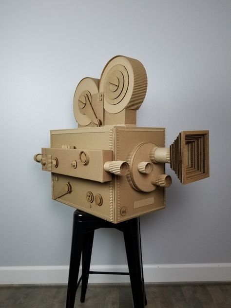 Vintage movie camera made of recycled cardboard. Handmade  by ©AlinesCardboard www.alinescardboard.com Cardboard Art Projects, Vintage Movie Camera, Cardboard Camera, Cardboard Art Sculpture, Cardboard Props, Deco Cinema, Cardboard Recycling, Cardboard Box Crafts, Cardboard Toys