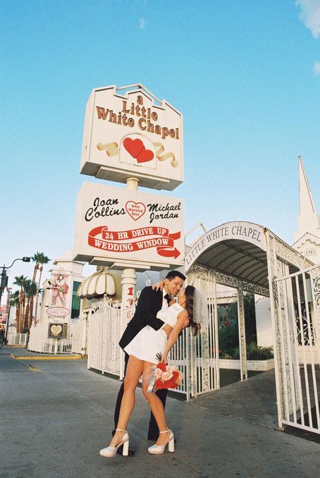 Kitschy Kodak Moments in the Heart of Las Vegas Imagine eloping in the iconic Little White Wedding Chapel, the heart of Las Vegas. Your love story is captured in the romantic hues of 35mm film by an ace film photographer. With a nod to vintage charm, you wear a short, dazzling wedding dress amid neon lights. The downtown landscape is the perfect setting for this kitschy elopement. Let your love story be as unique as you are! Las Vegas, Chapel Elopement, White Wedding Chapel, Grand Canyon Tours, Las Vegas Wedding Photos, Vegas Bride, Vegas Wedding Photos, Vegas Wedding Chapel, Little White Chapel