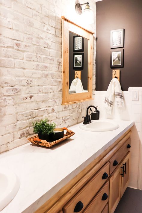 When we made over the boys bathroom, I knew I wanted a showstopper. Here's how to install and limewash brick veneer accent wall. Faux Brick Wall Bathroom Master Bath, Whitewash Brick Bathroom, Faux Brick Wall Bathroom Ideas, Faux Brick Bathroom Floor, Brick Tiled Bathrooms, Shiplap And Brick Bathroom, Faux Brick Wall In Bathroom, Brick And Shiplap Wall Bathroom, Painted Brick Bathroom Wall