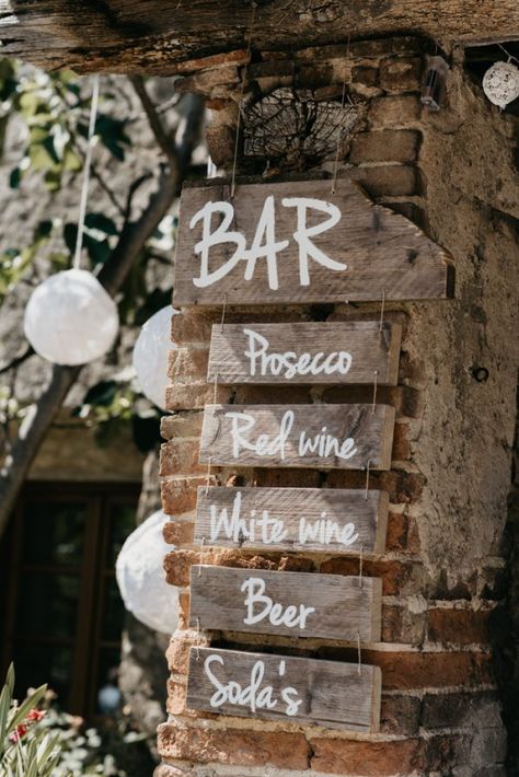 Earthy Bohemian Outdoor Wedding in Tuscany | Junebug Weddings Earthy Restaurant Design, Bohemian Cafe Interior, Rustic Outdoor Bar, Bohemian Cafe, Rustic Outdoor Spaces, Rustic Signage, Intimate Outdoor Wedding, Boho Bar, Earthy Bohemian