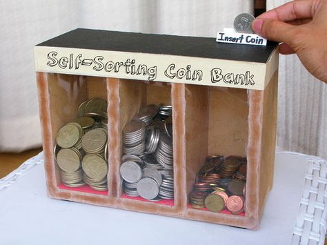 Self-Sorting Wooden Coin Bank  *use 3 separate shoe boxes glue together decorate with paint, scrape fabric or paper Coin Sorting, Coin Sorter, Piggy Bank Diy, Diy Hanging Shelves, Piggy Banks, Coin Bank, Mason Jar Diy, Mason Jar Crafts, Jar Crafts