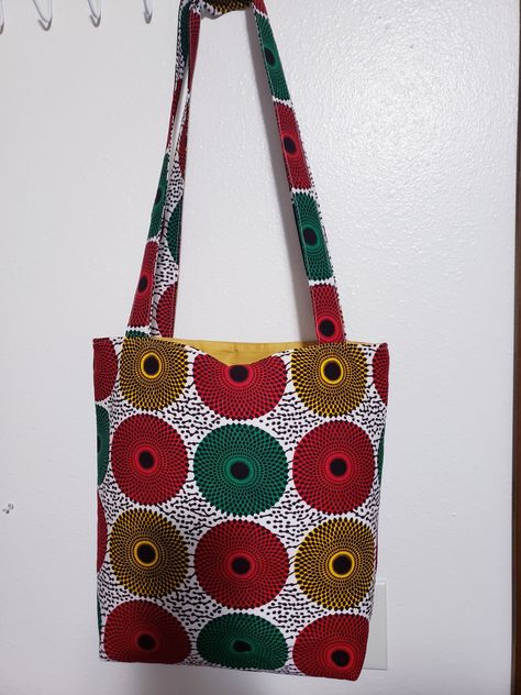 You will love this new African print 14 by 4.5 by 14 (l * w * h) in. tote bag, which be used to carry baby items, laptops, books, shopping, and other miscellaneous items. It has five pockets: 3 on the inside and 2 on the outside. God bless you. Clothing Pattern Design, African Gifts, African Bag, Diy Bags Purses, Couture Sewing Techniques, Miscellaneous Items, Printed Purse, Bag Trends, Simple Bags