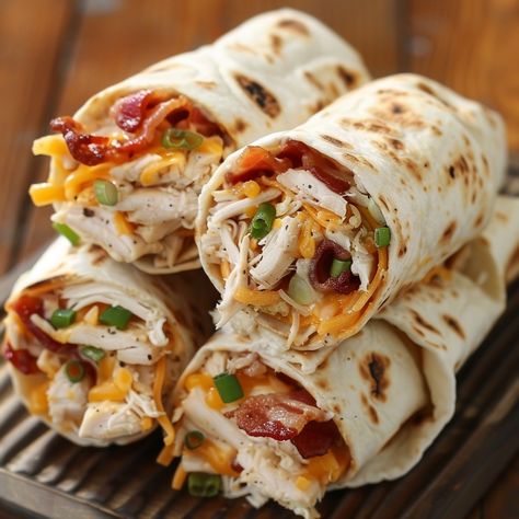 🥓 Try these Chicken Bacon Ranch Roll-Ups for a quick and delicious meal! 🐔🥓 #EasyMeals #ChickenRecipes Chicken Bacon Ranch Roll-Ups Ingredients: Flour tortillas (4) Cooked chicken, shredded (2 cups) Bacon, cooked and crumbled (8 slices) Ranch dressing (1/2 cup) Shredded cheddar cheese (1 cup) Green onions, chopped (1/4 cup) Instructions: Spread ranch dressing evenly on each tortilla. Layer chicken, bacon, cheese, and green onions on top. Roll up each tortilla tightly and slice into pinwhe... Tortilla Roll Up Recipes, Sandwich Roll Ups, Meat Roll Ups, Chicken Bacon Cheese, Chicken Bacon Ranch Sandwich, Chicken Bacon Ranch Wrap, Chicken Shredded, Chicken Roll Ups, Layer Chicken