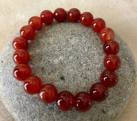 Excited to share this item from my #etsy shop: WILLPOWER - ENERGY - 10mm Carnelian Bracelet. Simple Stretch. Beaded Gemstone Bracelet. Unisex. Root/Sacral Chakra. Carnelian Beaded Bracelets With Natural Stones For Meditation, Handmade Carnelian Round Bead Bracelets, Handmade Spiritual Carnelian Beaded Bracelet, Beaded Round Carnelian Bracelets, Spiritual Carnelian Beads Jewelry 8mm, Living Jewelry, Healing Crystals Meanings, Meditation Bracelet, Carnelian Bracelet