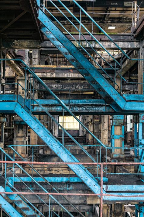 photo print of beautiful blue turquoise urbex industrial iron staircase in an abandoned  factory in France. This industrial urbex print in bold colors will fit into any industrial or modern decor scheme.  Enjoy the industrial vibe of this wall art in the living room, bedroom,  dining room, even the office! All my photographs are printed on professional, premium quality photo paper. The lovely satin or glossy finish provides intense colors that will last a lifetime. Thank you for visiting! All ph Industrial Aesthetic Photography, Industrial Set Design, Dark Industrial Aesthetic, Abandoned Factory Aesthetic, Industrial Design Aesthetic, Industrial Loft Apartment Warehouse Living, Abandoned Warehouse Aesthetic, Industrial Esthetic, Industrial England