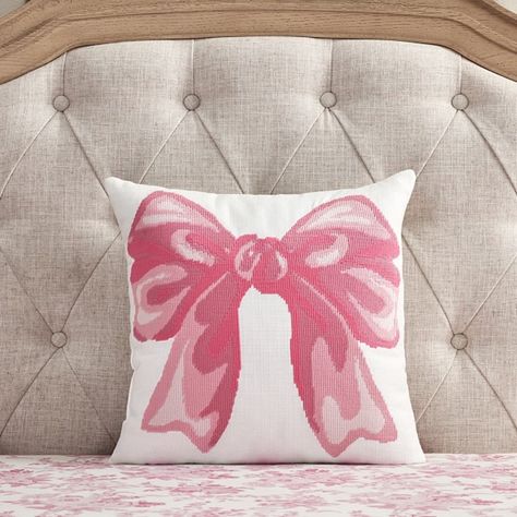 Give their space a whimsical touch with a plush pillow showcasing a large pink bow. This decor is crafted from durable cotton canvas using a needlepoint-inspired print that is sure to complement the rest of their bedding. Designed exclusively for Pottery Barn Kids by lifestyle brand LoveShackFancy. DETAILS THAT MATTER Made of 100% yarn-dyed cotton canvas. Yarn-dyed fiber has incredibly rich color that holds its vibrancy over time. Reverses to the same fabric. Fill is made of 100% recycled polyester. Features needle point-looking technique stitching detail on front of pillow. Made in a Fair Trade Certified(TM) factory, supporting fair and safe labor practices and empowering workers to invest in their communities. OEKO-TEX(R) STANDARD 100: tested for 1000+ harmful substances to keep you and Pink Blue And Gold Bedroom, Loveshackfancy Home, Throw Pillows For Bed, Cute Couch Pillows, Cute Pink Room Decor, Pink And Gold Room Decor, Preppy Throw Pillows, Loveshackfancy Bedding, Pottery Barn Love Shack Fancy