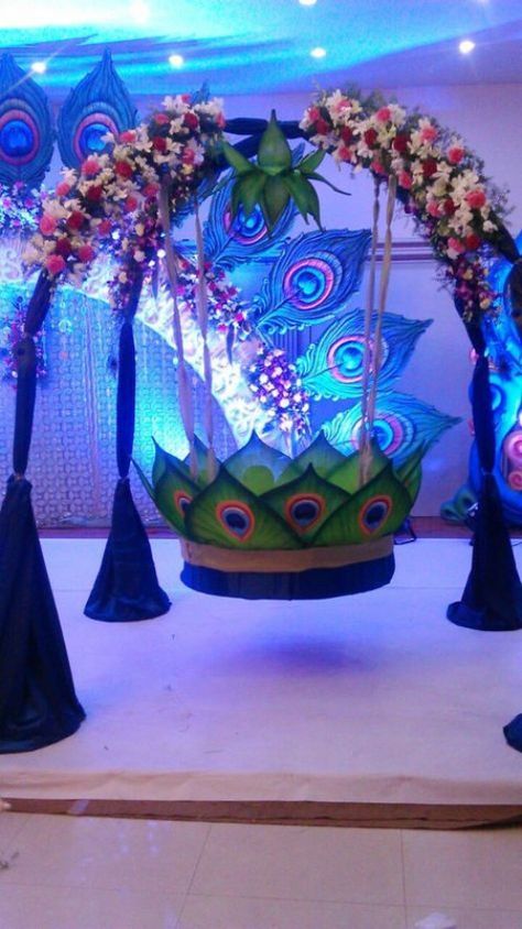 Peacock theme Cradle ceremony decoration #weddingceremonydecor #wedding #ceremony #decor #cases Cradle Ceremony Decoration, Cradle Decoration, Ganpati Decoration Theme, Naming Ceremony Decoration, Cradle Ceremony, Ganpati Decoration At Home, Janmashtami Decoration, Ganapati Decoration, Decoration For Ganpati