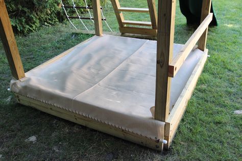 The sandbox, and an affordable DIY sandbox cover | Sushi Grass & Fireflies Diy Sandbox Cover, Yurt Backyard, Sandbox Cover Diy, Sandbox Under Swingset, Boat Sandbox, Modern European Farmhouse, Sand Boxes, Sandpit Cover, Sandbox Cover