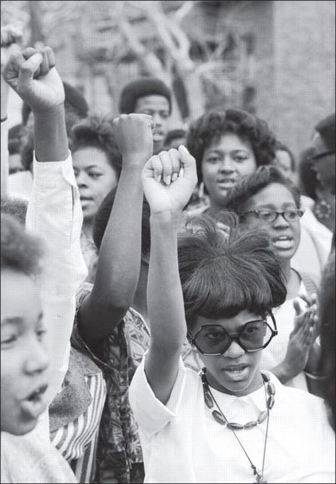 A group of young black women raise their fists in a black power salute.  Photo credit: Getty  Does anyone know when this photo was taken, who the photographer was, and where it was taken? Civil Rights Movement, African American History, Black Power Salute, Black Panther Party, Plakat Design, Power To The People, Foto Vintage, Black Pride, Paris Hilton