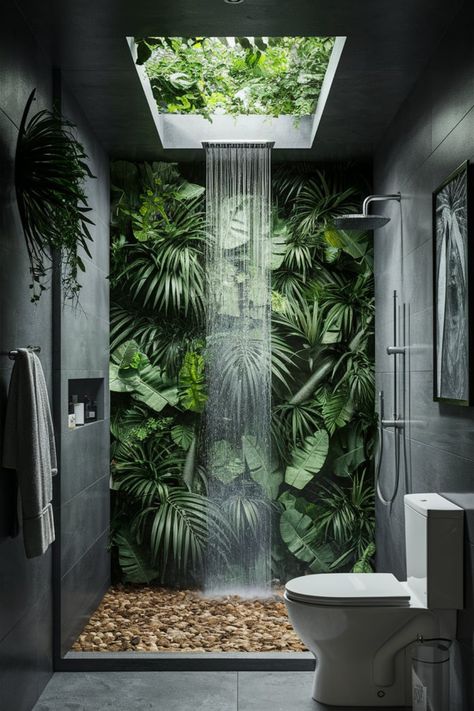 Transform your bathroom into a lush sanctuary with a skylight waterfall shower and tropical plants. Embrace the serenity of a rainforest-inspired design to bring the wild beauty of nature indoors. #RainforestBathroom #NatureInspiredDesign #BathroomRetreat #SkylightShower #TropicalGreenery #BathroomInspo #SereneSpaces #BathroomGoals #NatureVibes #LuxuryBathroomDesign Modern Jungle Bathroom, Walk In Shower With Plants, Plants In Bathroom Ideas, Waterfall Shower Bathroom, Bathroom Ideas Plants, Rainforest Bathroom Ideas, Rainshower Bathroom, Modern Tropical Bathroom, Plants In Shower