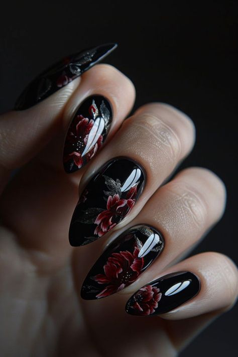 Blooming in darkness, these romantic floral nail designs pair perfectly with your Little Black Dress. Moody hues of burgundy, plum and emerald flatter with feminine edge and gothic allure. #nailart #naildesign #blacknails #darkfloralnails #gothicnails #NailDesignsBlackDress #romanticnails Dark Plum Nails With Design, Moody Floral Nails, Dark Floral Nail Art, Dark Romantic Nails, Dark Elegant Nails, Dark Moody Nails, Dark Nail Designs Gothic, Dark Floral Nails, Dark Wedding Nails