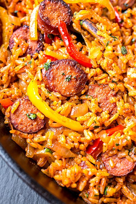 This smoked sausage and red rice skillet is filled with sausage, peppers, and onions, and a hint of tomato—it's the ultimate quick and easy one pan meal! | thecozyapron.com #smokedsausageandredriceskillet #smokedsausage #redrice #skilletmeal #onepanmeal #onepotmeal #ricedish Rice Ideas, Pasta Sausage, Sausage And Rice, Smoked Sausage Recipes, Rice Skillet, Sausage Dishes, Dinner Chicken, Red Rice, Chicken Fried