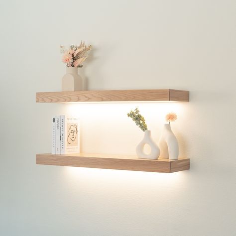 Custom floating shelves made from White Oak wood with integrated LED lighting. Available with 3000k (warm white), 4000k (soft white), or 6000k (cool white) LED lighting to compliment any space.