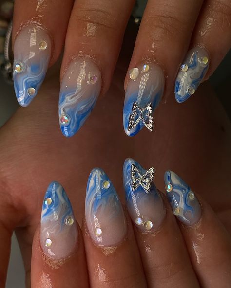 Summer blue marble 🦋💦🩵 Blue And Gold Nails Acrylic, Blue Gel X Nails, Butterfly Nails Blue, Almond Nails Designs Summer, Cloud Nails, Cute Almond Nails, Almond Acrylic Nails Designs, Ocean Nails, Gold Acrylic Nails