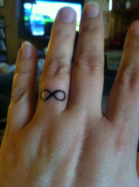 Infinity tattoo on my ring finger Infinity Tattoo On Finger, Old Women With Tattoos, Small Infinity Tattoos, Pink Flower Tattoos, Tattoo On Finger, Simple Finger Tattoo, Half Sleeve Tattoos Forearm, Strong Woman Tattoos, Small Chest Tattoos