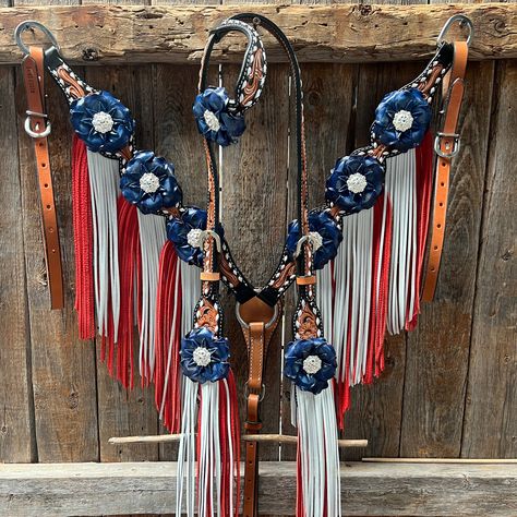 Browband, one ear and breastcollar is classic style. They are decorated with bright silver Clear crystal conchos, blue gardenias and red/white leather fringe. Full Horse size Measurements Headstall measurements : bit to bit - 36" shortest setting : 44" longest settingBrowband measures 15" acrossBreastcollar measurements - From Center Ring to D Ring -16"Breastcollar including toggles : shortest settings - 26" : Longest settings -29" Lifetime guarantee on all crystals. Buy Together or Separate BROWBAND ONLY - $314.00 ONE EAR ONLY - $246.00 BREASTCOLLAR ONLY - $491.00 BROWBAND TACK SET -$805.00 ONE EAR TACK SET - $737.00 23269 - 232701 - 5701 Horse Tack Sets, English Tack Sets, Horse Stall Decorations, Freebies On Your Birthday, Red Western Tack Set, Western Riding Tack, Pony Tack, Rodeo Fits, Bling Tack Sets