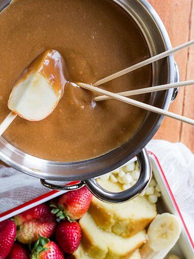 Peanut Butter Fondue Recipe | Allrecipes Peanut Butter Fondue, Broth Fondue Recipes, Raclette Recipes, Dessert Fondue, Fresh Pumpkin Pie, Fondue Night, Rhubarb Desserts, Milk Dessert, Fondue Recipes