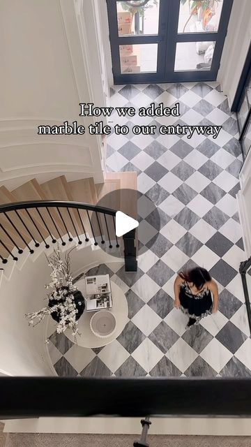 Annie Mescall on Instagram: "How we added this beautiful checkered pattern marble flooring to our entryway! By we, I mean the talented contractors. We add all the original wood removed because we wanted the tile to lay evenly with the wood flooring when it met other rooms. It took a day to remove the wood and to sand down the concrete from the wood glue and application. One thing we did ask the contractor to do was to try his best to lay the tile pattern in the same path. The flooring is a matte finished grey and white marble. In total it took 3 days and cost us $1,200 to the labor and $4,600 for the tile. ⭐️ Tile is from @riadtile 12x12!  Casablanca Carrara & Bardiglio Grey Marble – Honed – 12″x12″ Checkerboard Bundle #tile #checkeredfloor #diyproject #texashomes #marblefloors" Checkered Floor With Rug, Grey Checkered Kitchen Floor, Checkerboard Limestone Floor, Checked Floor Entry, Black And White Tile Foyer, Entryway Checkered Floor, Checkerboard Tile Entryway, Foyer Tile Design, Grey Checkerboard Floor