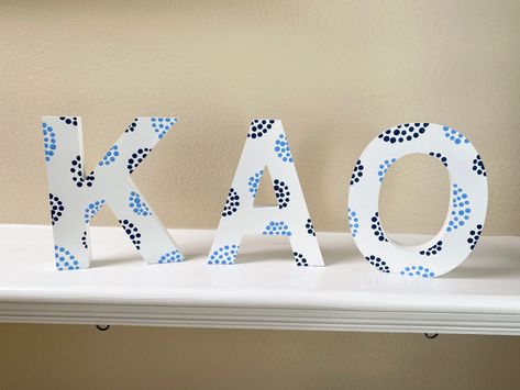 Wood Greek Letters Painted, Initial Painting Ideas, Greek Letter Painting Ideas, Sorority Letters Painted Wooden Easy, Blue Sorority Letters, Painted Greek Letters Wooden, Greek Letters Painted Sorority, Sorority Letter Painting, Sorority Letter Designs