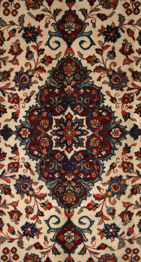 This Semi-Antique Persian Sarouk Rug is an outstanding piece of artistry. Its rectangular shape and hand-knotted construction, in addition to its wool pile and cotton foundation, make this exquisite rug a timeless classic. The ivory, burgundy, and blue colors of its floral patterned central medallion truly are remarkable. From Iran, this semi-antique rug is a must-have for any collector of Persian rugs. 1556 Turkish Rug Wallpaper, Persian Floral Pattern, Persian Carpet Wallpaper, Persian Rug Wallpaper, Persian Rug Aesthetic, Infernal Divine, Persian Carpet Pattern, Persian Room, Iran Rug