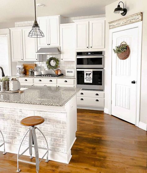 Farmhouse Kitchen Inspo 🌾❤️’s Instagram photo: “We give this gorgeous kitchen a 10/10! ❤️ What do you think?🙌 We LOVE the drawer pulls!! 👀 TAG a friend who will love this too! 👇…” Above Pantry Door Decor, Pantry Door Decor, White Interior Door, Dark Wood Floor, White Kitchen Cupboards, White Interior Doors, White Cupboards, Black Sconces, White Shiplap Wall