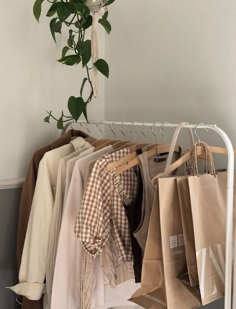 clothes hanging rack, college apartment decor, cozy house, cozy bedroom, cozy room decor, college dorm room ideas, college apartment bedroom, fall decor living room, warm apartment aesthetic, apartment decor, apartment decor ideas, bedroom decor, organization ideas for the home, organizing ideas Clothes In Rack Aesthetic, Bedroom Ideas Clothing Rack, Rack Clothes Aesthetic, Cloth Rack Aesthetic, Aesthetic Clothing Rack Bedroom, Rack Of Clothes Aesthetic, Closet Rack Aesthetic, Clothes Hanging Aesthetic, Cute Clothes Rack