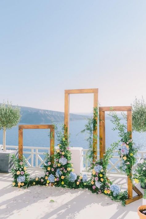 Frame wedding ceremony arch- Greece wedding. #floral #diy #decor #wedding #weddingdecor #weddingdesign #blommadesigns #alaska #alaskawedding #alaskaweddingplanner #weddingfloral #design #alaskabride Booths Ideas, Mediterranean Wedding, Wedding Ceremony Arch, Arch Decoration Wedding, Wedding Ceremony Backdrop, Santorini Wedding, Wedding Scene, בר מצווה, Greece Wedding