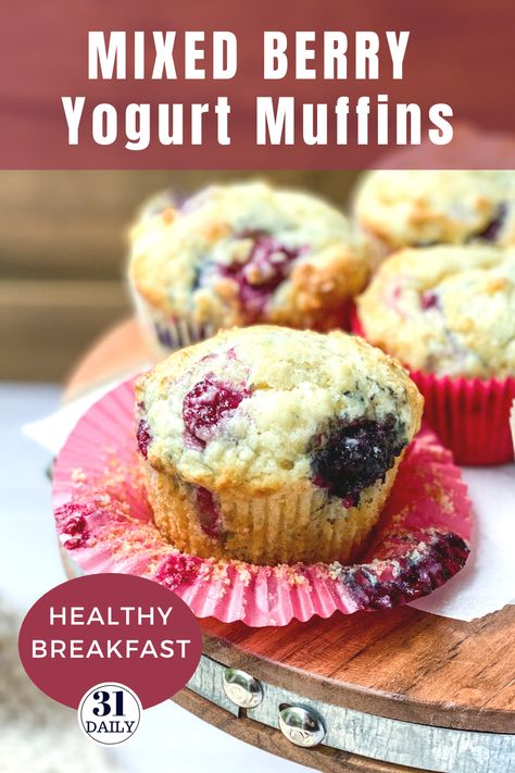 These Mixed Berry Yogurt Muffins are lofty and so moist they almost melt in your mouth. Filled with berries, they are healthy and sweet. This easy recipe is perfect for breakfast, brunch, or a healthy snack. In-season berries are a perfect choice but frozen berries work great too. Be sure to get this recipe at 31daily.com #muffins #berries #mixedberries #brunch #healthysnack #31Daily Greek Yogurt Berry Muffins, Yogurt Berry Muffins, Healthy Mixed Berry Muffins, Yogurt Fruit Muffins, Berry Breakfast Muffins, Mixed Berry Muffins Easy, Frozen Berries Muffins, Fresh Berry Muffins, Mixed Berry Muffins Fresh Berries