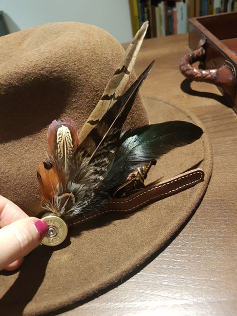 Make your own fedora feather & shot gun cartridge hatband. �– Gift Horse Eventing Cowboy Hat Bands Diy, Hat Bands Diy, Hat Bands Diy Ideas, Pheasant Feather Decor, Horse Eventing, Shell Casings Crafts, Cowboy Hat Bands, Personalized Jacket, Hat Bands