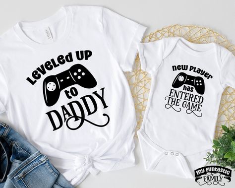 Leveled up to daddy - new player has entered the game! This funny matching daddy and me shirt set is perfect for new dad and new baby! Perfect humor gaming dad gift, and a great funny gift for pregnancy announcements. Funny Matching Daddy And Me Shirts, Leveled Up To Daddy, Gaming Dad, Daddy To Be 2022, New Dad New Baby Gift 2022, Funny Dad And Baby Outfit Check out our full collection of awesome here: https://www.etsy.com/shop/MyFuntasticFamily HOW TO ORDER: All shirts are added individually to Nephew Shirts, Future Parents, Aunt Niece, Funny Matching, New Aunt, Pregnancy Announcements, Auntie Gifts, Uncle Gifts, Outfit Check