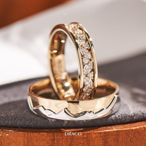 Our latest wedding band set features a bright cut pave ring in 18K yellow gold for her, adorned with alternating marquise and round diamonds. For him, a duo-tone ring with a White gold mountain motif backed by a sky of yellow gold. These custom-made rings make a unique and powerful statement of love and commitment. Masc Lesbian Wedding Ring, Wedding Bands His And Hers Unique, Wedding Rings Sets His And Hers Unique, Wedding Ring Ideas Unique, Couple Rings Design Unique, His And Hers Wedding Bands, Unique Diamond Wedding Bands, خواتم خطوبة, Wedding Rings Sets His And Hers