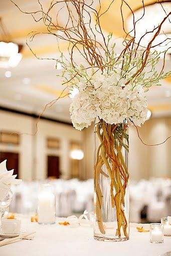 Tall centerpiece arrangement with hydrangeas, dendrobium orchids and curly willow. Branch Centerpieces Wedding, Centerpieces Simple, Wedding Branches, Curly Willow, White Hydrangeas, Willow Branches, Deco Floral, White Hydrangea, Mother Son