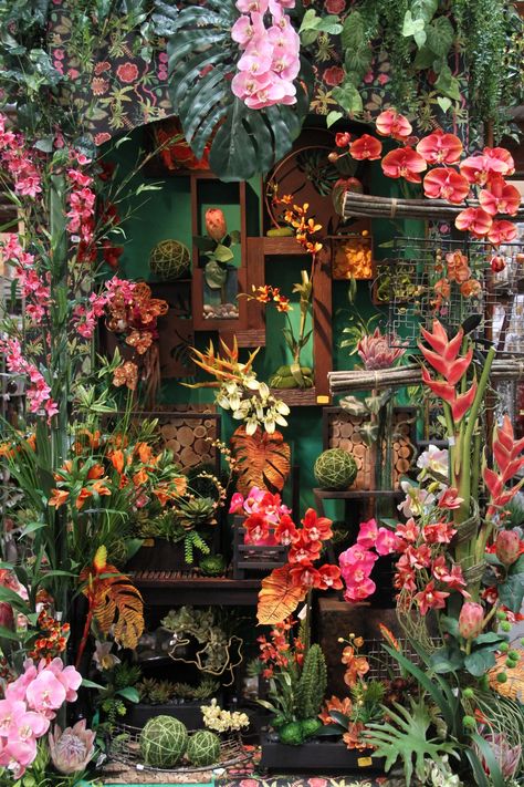 tropical Decorating With Orchids Interior Design, Tropical Flower Decor, Tropical Installation, Orchid Display Ideas, Tropical Garden Uk, Tropical Flower Garden, Tropical Flower Wall, Tropical Plant Wall, Orchid Garden Ideas