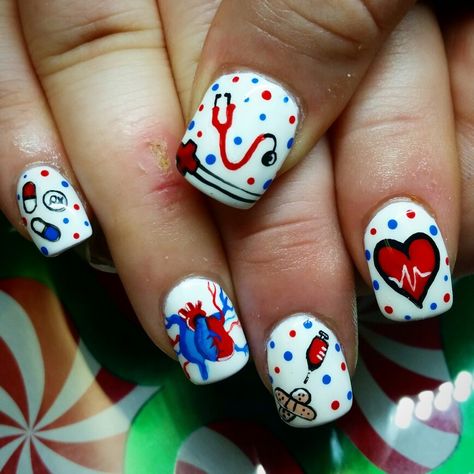 Nurse nails, hand painted by kryssy kaltenthaler Nurse Design Nails, Nurse Approved Nails, Nurse Nail Art Design, Nurses Nails, Nurse Nail Designs, Nurse Nails Acrylic, Nurse Nail Art Decals, Medical Nails, Doctor Nails