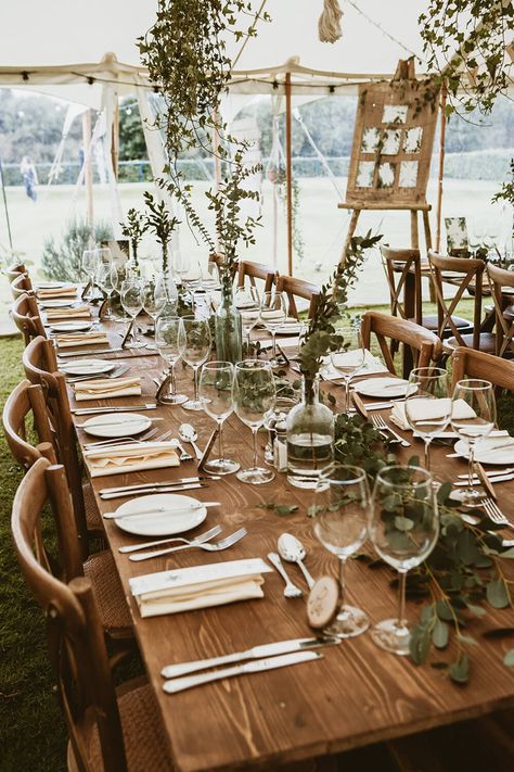 Table decorations at a rustic outdoor wedding Wedding Table Inspo Boho, Rustic Wedding Furniture, Wedding Marquee Ideas Rustic, Boho Marquee Wedding, Wedding Natural Decorations, Boho Wedding Marquee Decoration, Marquee Event Decor, Rustic Wedding Marquee Decor, Marquee Table Decorations