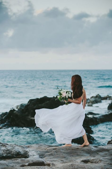 The bride walks barefoot in the wind across rocks near the ocean to her wedding ceremony on Maui. Click to see more of this romantic Maui elopement at the Haiku mill followed by a ceremony by the ocean captured by Hawaii photographer Melia Lucida. ..#mauielopement #maui #hawaii #hawaiiwedding #mauiwedding #mauiphotographer #hawaiiphotographer #mauibride #elopement #destination #wedding #tropical #aloha #melialucida Oceanside Wedding, Maui Elopement, Cliff Wedding, Haiku Mill, Cliff Side, Beach Theme Wedding Invitations, Maui Photographers, Wedding Tropical, Sea Wedding