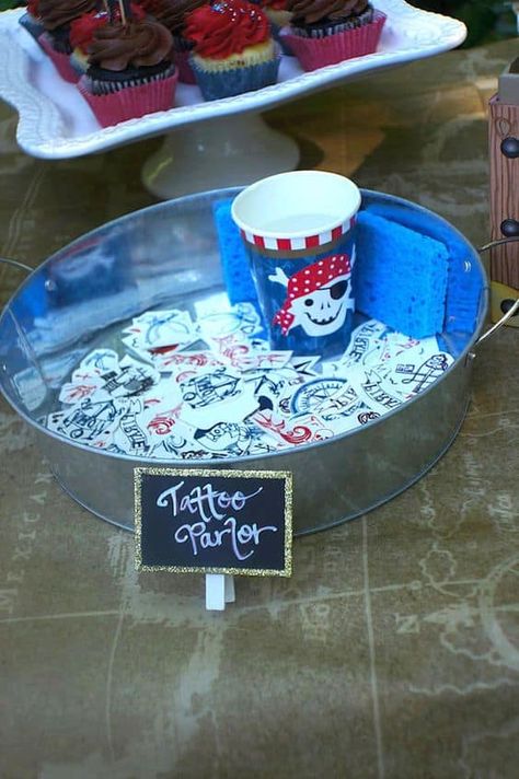 Tattoo Parlor Pirate Party, Pirate Theme Costume Ideas, 1st Birthday Pirate Theme, Pirate Party Tattoo Parlor, Mermaid And Pirate Party Food, Pirate Themed Party Decorations, Pirate Party Ideas Decorating, Pirate Themed 1st Birthday Party, Mermaid Pirate Party Decorations