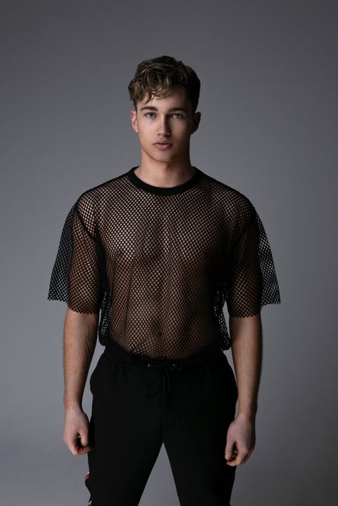 Strictly Come Dancing star AJ Pritchard steals the spotlight as he covers the March 2019 issue of Gay Times. The 24-year-old dancer sports a Versace t-shirt and Topman joggers for the cover. Meanwhile, Jakub Koziel Queer Outfits, Pride 2023, Ideas De Outfits, F Men, Gay Outfit, Versace T Shirt, Gay Fashion, Queer Fashion, Mesh T Shirt