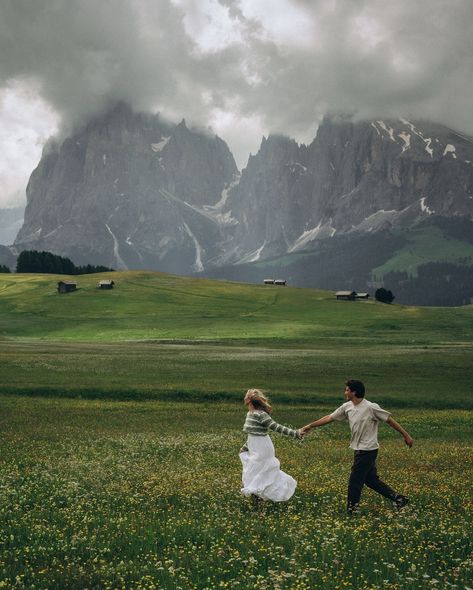 two lovers running through the meadows of the italian dolomites • • • keywords: documentary photography, cinematic photography, visual poetry, storytelling, love, couples photoshoot, tampa elopement, travel photographer, couples inspo, romcom, movie scenes, italy, dolomites, dolomites photos 🏷️ #floridaphotographer #tampaphotographer #stpeteweddingphptographer #tampaweddingphotographer #destinationweddingphotograoher #stpetephotographer #film #visualpoetry #cinematicphotographer #floridaw... Elopement Italy, Tampa Elopement, Mountains Photoshoot, Dolomites Elopement, Italian Dolomites, Photography Cinematic, Authentic Love, Dolomites Italy, Outdoor Couple