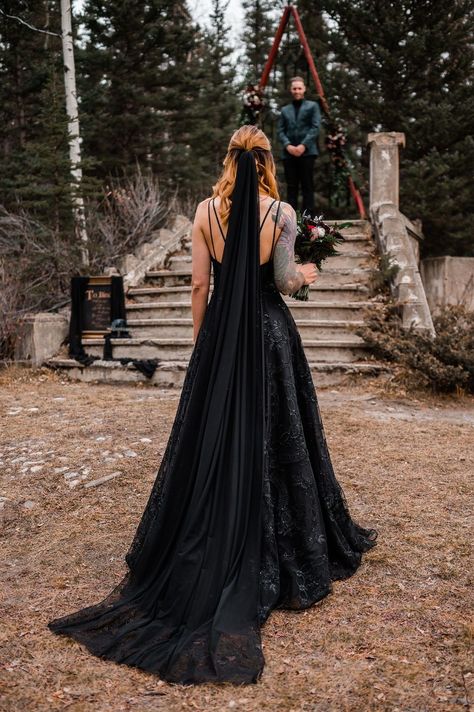 Devil's Night Elopement in Banff | IG: Decor & Rentals - @orangetrunk Groomsmen Attire - @ewmenswear Beauty - @juliajoybeautyco Formal Wear - @durandbridal Jewelry - Strattons Jewellery Decor - @theknotgardenyyc Stationery - @hollylovespaper Unique Ideas - @mountaingrovestudio Wedding Flowers - @littledaisyflorals Wedding Cake - @blackdog_bakery Wedding Planning - @heather_johnston_creative Wedding Photography - @heyjackielarouche #halloweenwedding #albertawedding Gothic Groomsmen Attire, All Black Elopement, Black Aesthetic Wedding Dress, Black Wedding Dress With Veil, Gothic Groom Attire, Goth Western Wedding, Dark Wedding Venues, Gothic Wedding Photos, Black Wedding Dress Aesthetic