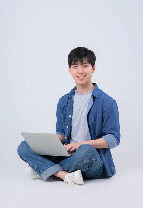 Premium Photo | Young asian man sitting and using laptop on white background Man With Laptop, Male Office, Pose Photography, Face Swap, Asian Man, Element Design, Draw The Squad, Image Memes, Face Swaps