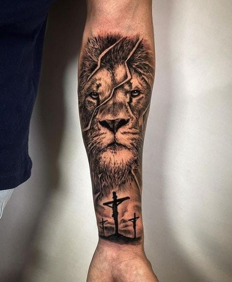 Lion Tattoo Inner Forearm, Parent Tattoos For Men, Christian Bicep Tattoo Men, Lion Tattoo With Cross, Christian Tattoos For Men Sleeve, Tattoos Men Forearm, Lion Cross Tattoo, Mens Cross Tattoo, Male Arm Tattoos