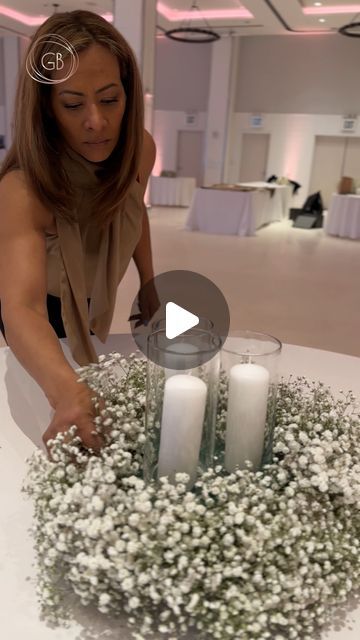 Flowers 🌺 By G Bella- Wedding Stylist|Floral Designer on Instagram: "Remember those gorgeous baby’s breath table runner arrangements we highlighted last week? Well, we’re back to talk more details from that wedding because we are simply obsessed with how it all turned out 😍  This time, we want to highlight the complimentary round table centerpieces.   We kept it more minimal for the round tables and created wreaths out of baby’s breath with candle votives inside the wreaths. These airy arrangements not only complimented the longer tables’ elaborate designs but also added an ethereal charm to the reception space.   And here’s a quick #GBellaTuesday tip for you: Putting foam in the middle of the wreaths allows the candle votives to stand out amidst the baby’s breath, creating more harmony Round Table Party Centerpieces, Wreath Centerpieces Wedding, Baby’s Breath Baby Shower Table Decor, Baby’s Breathe Centerpieces, Candle Wedding Centerpieces Round Tables, Table Runner For Wedding Reception, Round Mirror Centerpiece Ideas, Baby Breathe Center Piece Ideas, Floral And Candle Centerpieces