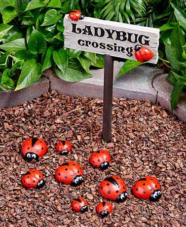 Create an adorable scene in your yard with this Ladybug Garden Décor. Place the Ladybug Crossing Sign (8"W x 15-1/2"L, including the 3" ground st Ladybug Crossing, Kebun Herbal, Ladybug Garden, Jardim Diy, Garden Small, Diy Bird Feeder, Tanah Liat, Kraf Diy, Rock Garden Landscaping