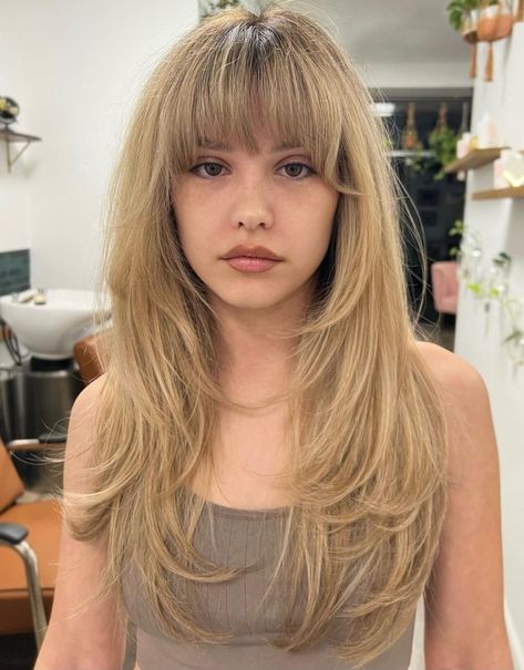 Long Feathered Hair with Brow-Grazing Bangs Long Hair Half Up Half Down With Bangs, Midi Length Hairstyles, Butterfly Haircut With Full Bangs, Long Choppy Layers With Bangs, Mid Length Hair With Fringe Bangs, Long Blonde Bangs, Fringe Bangstyle Hair, Hidden Bangs, 2000s Haircuts