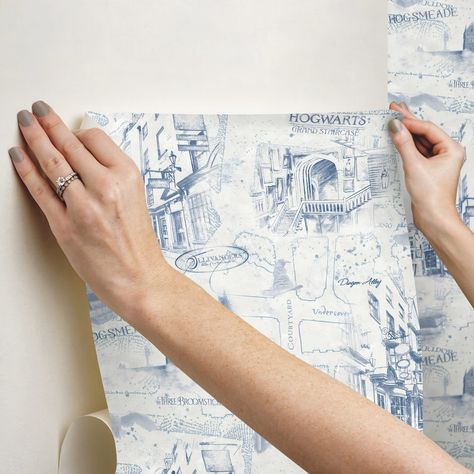 "Find this RoomMates Blue Harry Potter Map Peel & Stick Wallpaper at Michaels. com. This graceful map pattern creates a surreal look with minimal effort. Modern yet timeless, create an Hogwarts-worthy room in minutes with our peel and stick technology. Mystical and magical, Harry Potter Map Peel and Stick Wallpaper is sure to catch the eye of everyone who enters your home. This graceful map pattern creates a surreal look with minimal effort. Modern yet timeless, create an Hogwarts-worthy room in Harry Potter Bedrooms, Harry Potter Map, Celestial Boho, Harry Potter Nursery, Harry Potter Room Decor, Harry Potter Bedroom, Dorm Furniture, Map Pattern, Harry Potter Baby