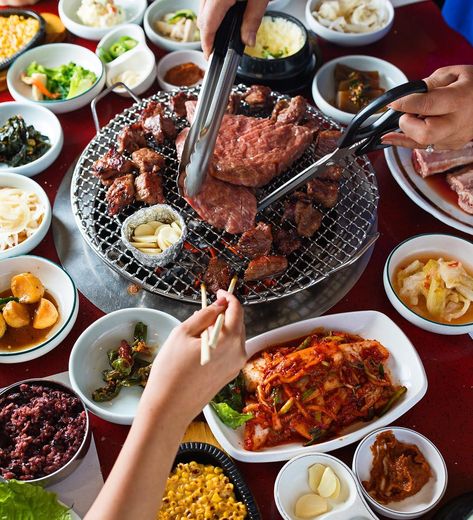 It's Friday night, do you know which Korean Barbecue you're going to!? Korean BBQ is a favorite of TT Editors -- what's not to love about the table crammed with shallow bowls of kimchi and other banchan, marinated meats grilling away mere inches before you, pitchers of never-ending soju and the fact that it's always someone's birthday? #tastingtable #Koreanbarbecue #Koreanfood #Kimchi #noms #foodie #bbq Samgyeopsal Korean Food, Korea Bbq, Seafood Ramen, Korean Barbecue, Ramen Soup, Propane Grill, K Food, Short Rib, Korean Dishes